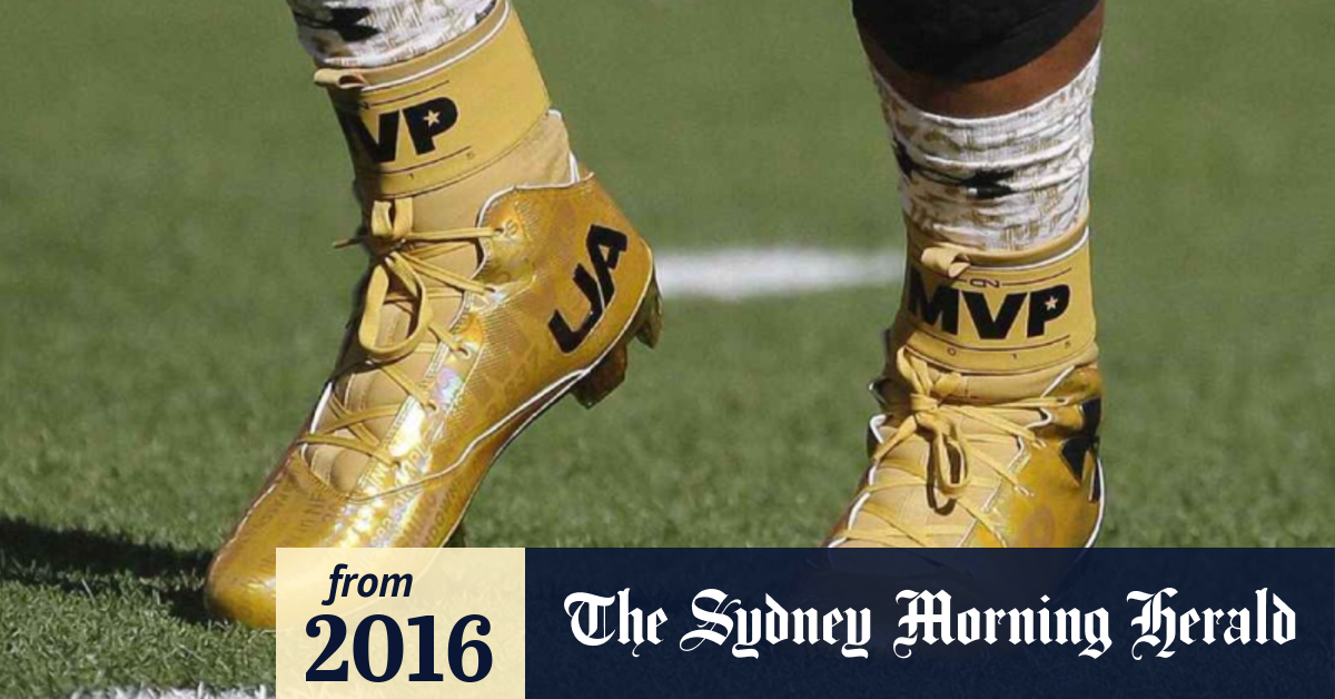 Superbowl 50 NFL MVP Cam Newton wears gold cleats with statistics